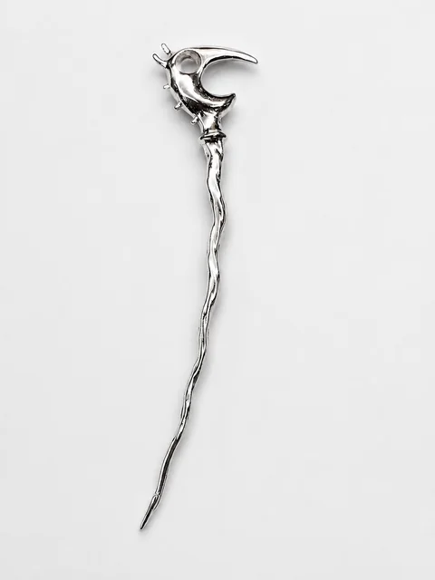 Full chrome Dragon Pick photographed against white.