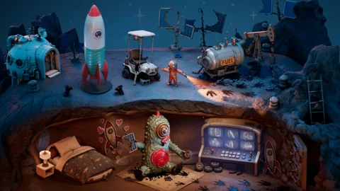 A space-monster diorama by Dylan Sisson, with a rocket on the surface and a furnished underground room.