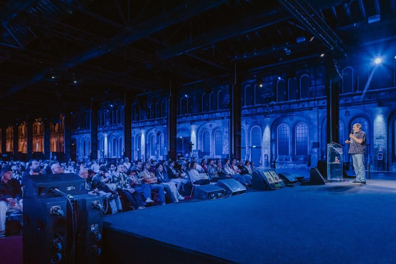 Dylan Sisson speaking to an audience at VIEW Conference in Italy.